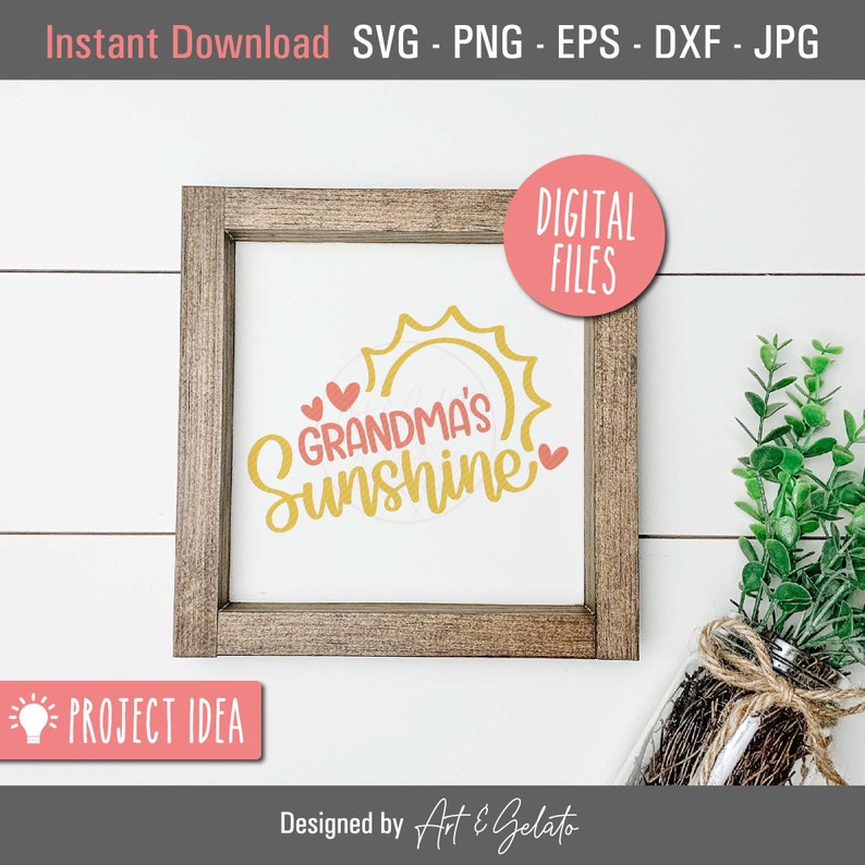 May include: A framed sign with a yellow sun and the text "Grandma's Sunshine" in yellow with two pink hearts. The sign is on a white wooden background.