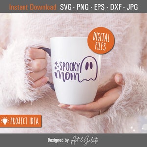 May include: White ceramic mug with a purple ghost and the text "SPOOKY mom" in purple lettering.