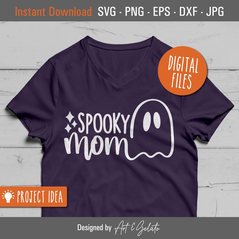 May include: A purple t-shirt with a white ghost and the text "SPOOKY mom" on it. The text is in a handwritten font. The shirt is a project idea for a Halloween craft.
