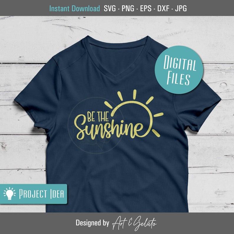 May include: A navy blue t-shirt with a yellow sun graphic and the text "Be the Sunshine".