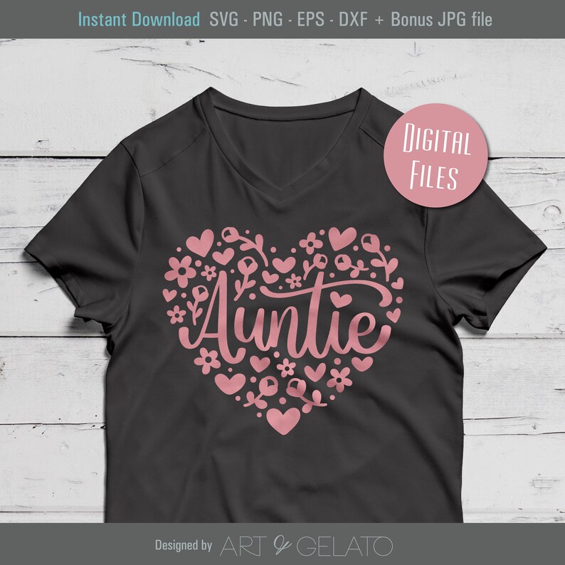 May include: A black t-shirt with a pink heart design that says "Auntie" inside the heart. The heart is surrounded by pink flowers and hearts.