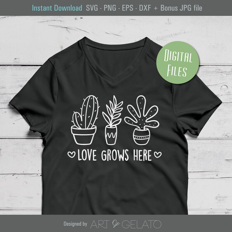 May include: A black t-shirt with a white design of three potted plants and the text "LOVE GROWS HERE" in a heart-shaped frame. The design is in a simple, hand-drawn style.