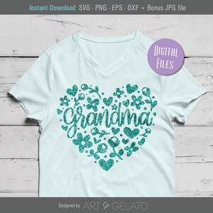 Pode incluir: Um design de cora&ccedil;&atilde;o de glitter azul turquesa com a palavra "Grandma" dentro. O design est&aacute; em uma camiseta branca.