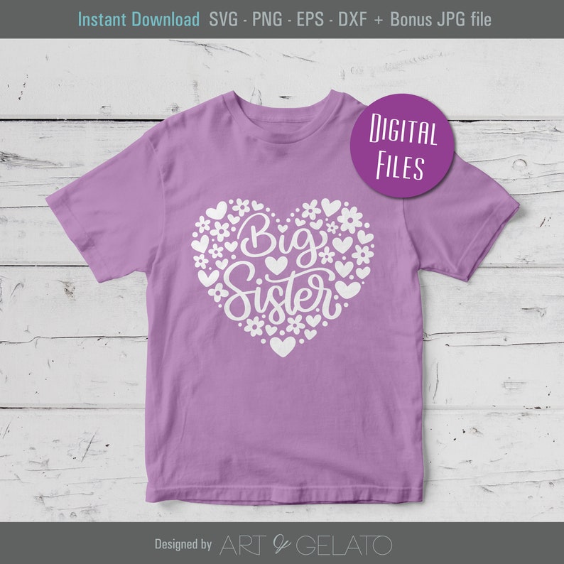 May include: A purple t-shirt with a white heart design. The heart is filled with small white hearts and flowers. The text "Big Sister" is written inside the heart.