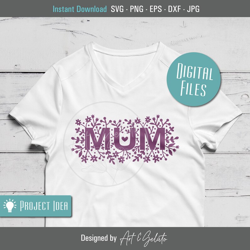 May include: A white t-shirt with a purple design of the word "MUM" surrounded by floral elements. The design includes a small heart in the middle of the word.
