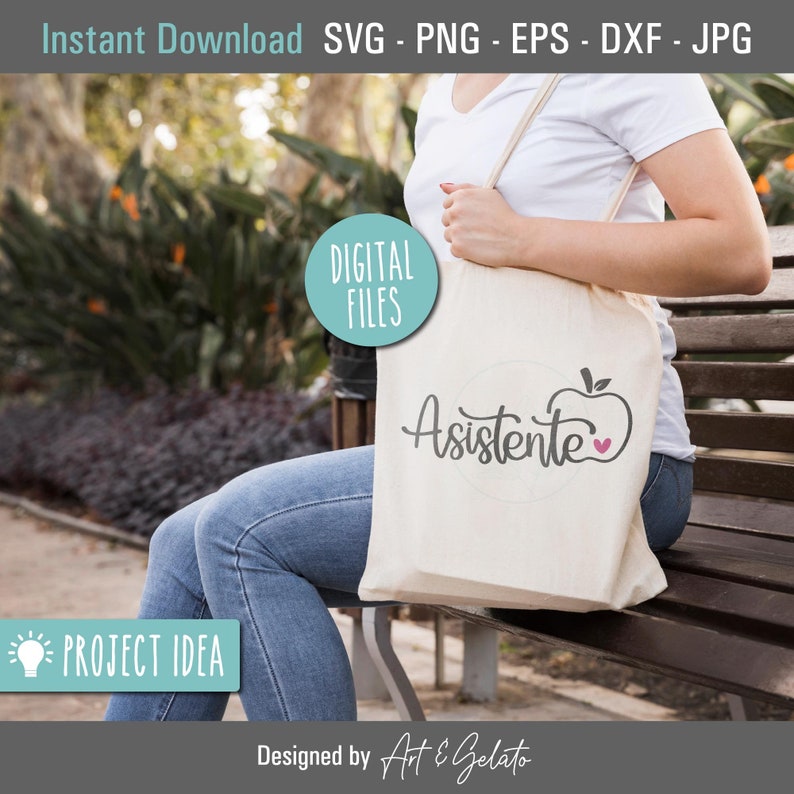 May include: A white tote bag with the text "Asistente" and a red apple with a pink heart on it. The bag is being held by a person wearing a white shirt and blue jeans.