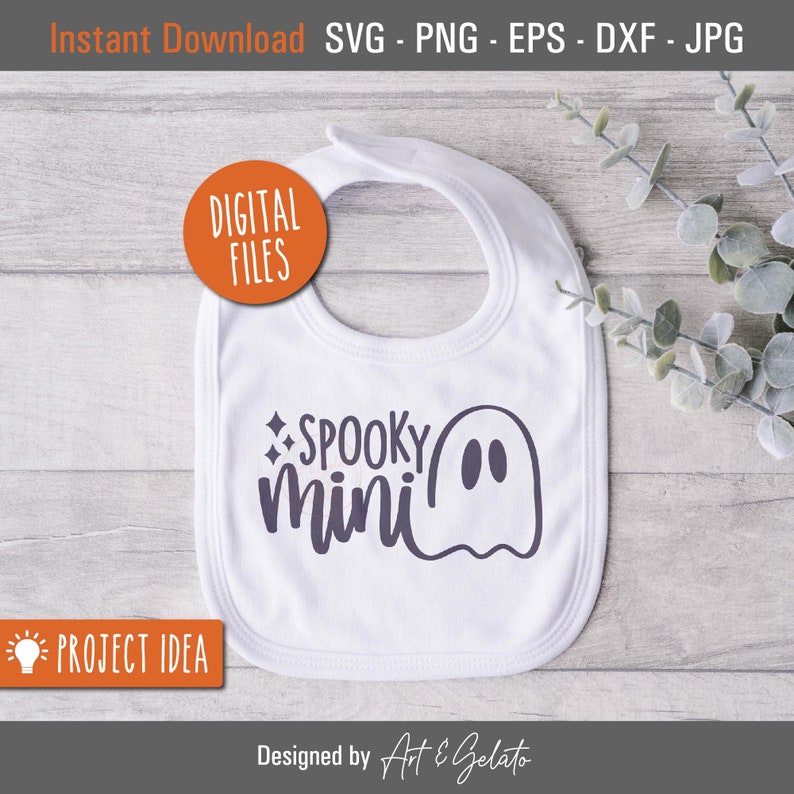 May include: White baby bib with a ghost and the text "SPOOKY mini" in purple.
