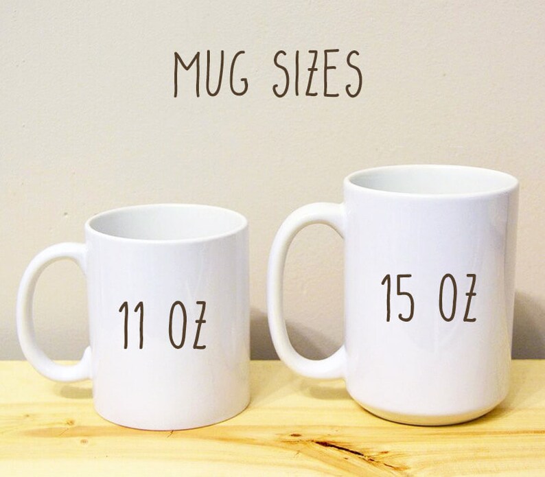 May include: Two white ceramic mugs, one 11 ounce and one 15 ounce, on a wooden surface. The text "MUG SIZES" is written above the mugs.