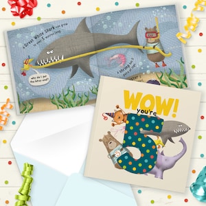 May include: A colourful book with a large number 5 on the cover. The number is decorated with blue and yellow polka dots. The book is surrounded by cartoon animals, including a bear, a cat, a shark, an elephant, and an octopus. The text on the cover reads "Wow! You're 5".