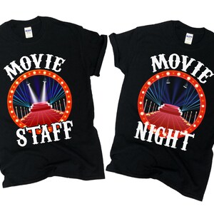 May include: Two black t-shirts with a red, white and blue movie night theme. One shirt says "Movie Staff" and the other says "Movie Night".