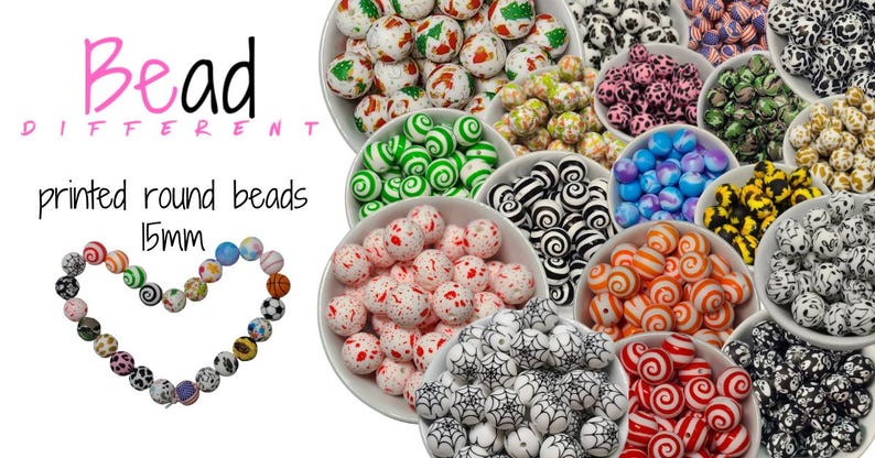 Bead Different logo with the words printed round beads 15mm wrote in black. Several small round display bowls filled with a wide ranged mixture of printed round beads.