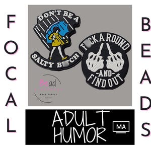 May include: Two black and white rubber shoe charms with humorous sayings. The first charm says "Don't be a Salty Bitch" and features a cartoon woman holding an umbrella. The second charm says "F*ck Around - And - Find Out" and features two skeleton hands with middle fingers extended.