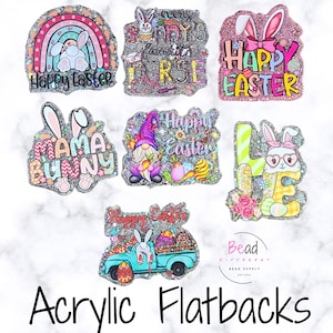 May include: A collection of glittery acrylic flatbacks with Easter-themed designs. The designs include bunnies, rainbows, and the text "Happy Easter" and "Mama Bunny". The flatbacks are in various shapes and colors.