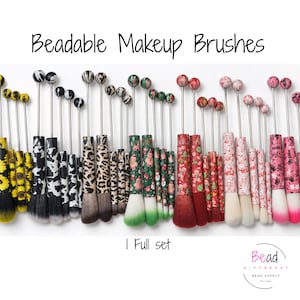 May include: A collection of beadable makeup brushes with patterned handles and metal rods topped with decorative beads. The set includes various designs such as sunflowers, cow print, leopard print, and holiday themes. Text reads Beadable Makeup Brushes and 1 Full set.
