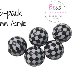 May include: Five 20mm acrylic beads with a black and white checkered pattern. The beads are spherical and are displayed against a white background. The text "5-pack 20mm Acrylic" is in the upper left corner.