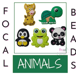 May include: Five colorful animal-shaped rubber charms, including a giraffe, turtle, frog, penguin, and panda. The charms are all about 2 inches tall and are perfect for adding a fun touch to jewelry, keychains, or other crafts.  Focal Beads ANIMALS