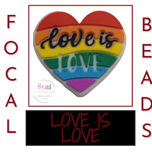 May include: A rainbow heart-shaped charm with the text "Love is Love" in black and white lettering. The charm is made of silicone and is perfect for adding a touch of personality to your jewelry or crafts.