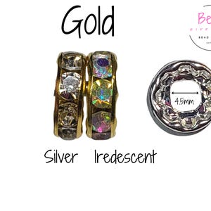 May include: Three different colored spacer beads for jewelry making. The beads are 10mm in diameter and have a 4.5mm hole. The beads are gold, silver, and iridescent.