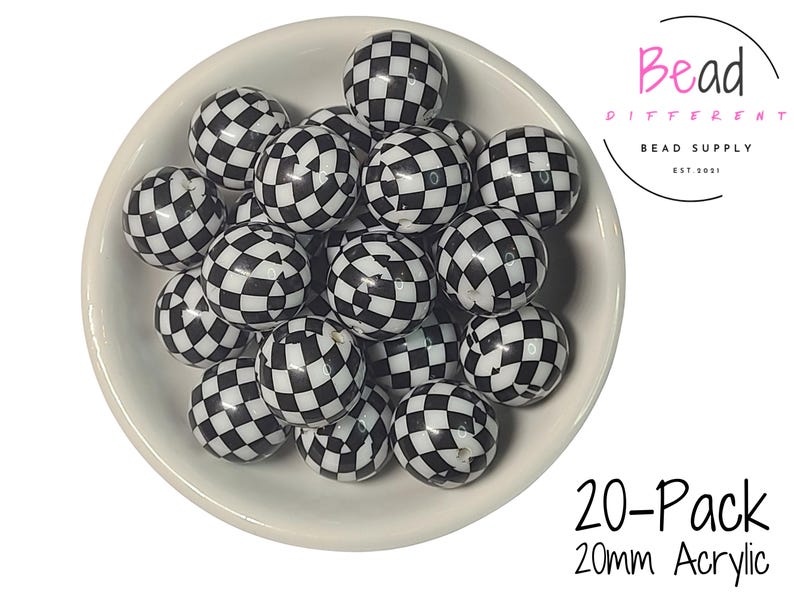 May include: A collection of black and white checkered acrylic beads, each 20mm in diameter, fills a white bowl. The beads have a glossy finish. The image includes the text "20-Pack 20mm Acrylic" and the logo for "Bead Different Bead Supply".