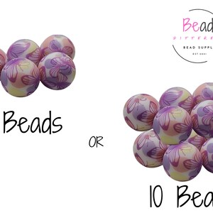 May include: A set of 5 or 10 colorful beads with a butterfly pattern. The beads are white with pink and purple butterflies. The beads are available in two sizes, 5 beads or 10 beads.