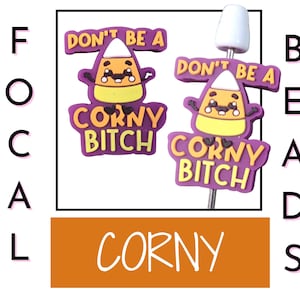 May include: Two candy corn-themed charms with the text "DON'T BE A" above and "CORNY BITCH" below. The charms are purple, yellow, orange, and white. The word "CORNY" is written in orange. The word "BEADS" is written in black.