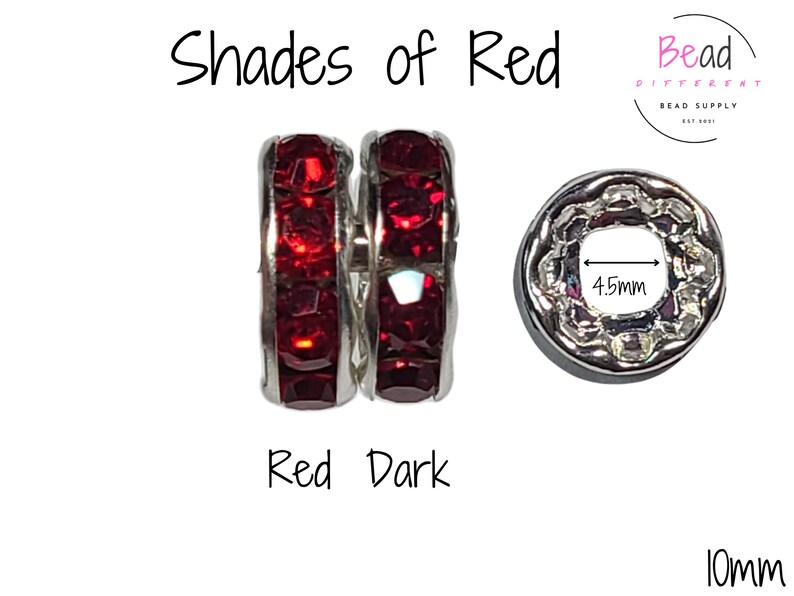 May include: Two silver spacer beads with dark red crystal accents. The beads are 10mm in diameter and have a 4.5mm hole. The beads are labeled "Shades of Red" and "Red Dark".