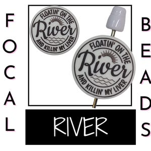 May include: White round beads with black text that reads "Floatin' on the River and Killin' my Liver". The beads are on a white background with the word "River" in black text.