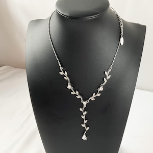 Vintage Trailing Vine Silver Tone Rhinestone Necklace Marked VCLM