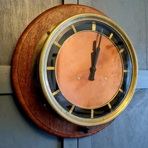 Vintage brass and copper wall clock