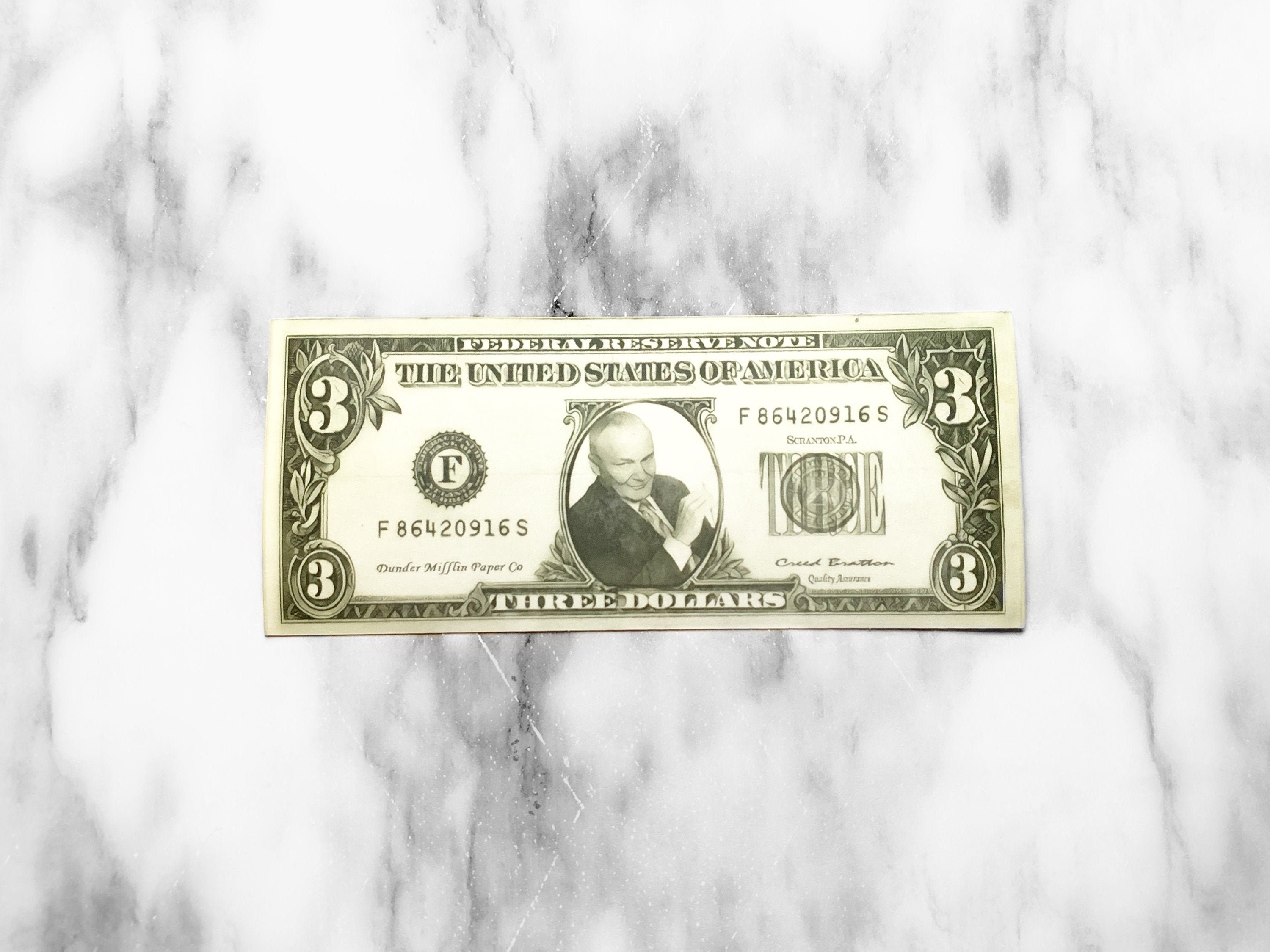 Who is that on Creed's $3 bill? : r/DunderMifflin