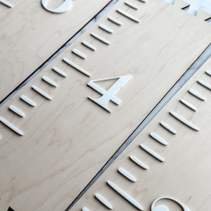 May include: Three wooden growth charts with white numbers and markings. The charts are labeled "6 yards", "4 yards", and "2 yards".
