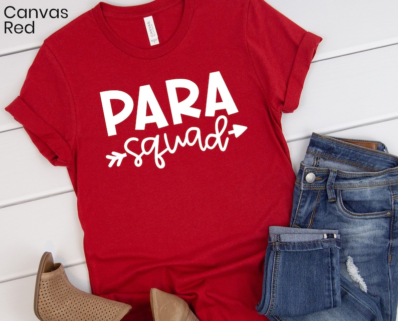 May include: Red t-shirt with white text that says "PARA squad" with an arrow pointing to the right.