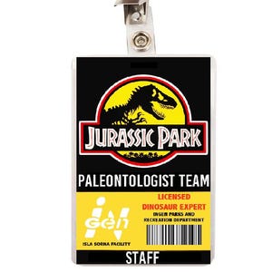 May include: A rectangular identification badge with a metal clip. The top features the Jurassic Park logo, the text PALEONTOLOGIST TEAM, and the InGen logo. The bottom section is yellow with the text LICENSED DINOSAUR EXPERT, INGEN PARKS AND RECREATION DEPARTMENT, ISLA SORNA FACILITY, a barcode, and the word STAFF.