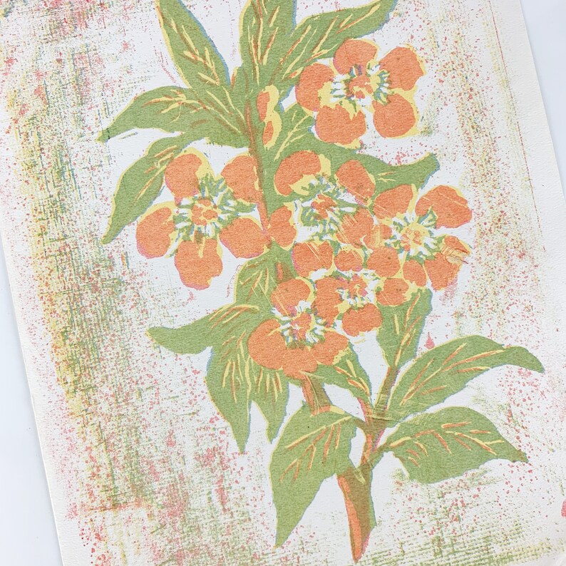 May include: A vintage print of a floral design featuring orange flowers with yellow centers and green leaves on a white background with a textured pattern.