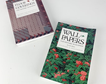 May include: Two books with hard covers. One book is titled "FLOOR COVERINGS FOR HISTORIC BUILDINGS" with a geometric design in shades of brown and gray. The other book is titled "WALL PAPERS FOR HISTORIC BUILDINGS" with a green floral pattern.