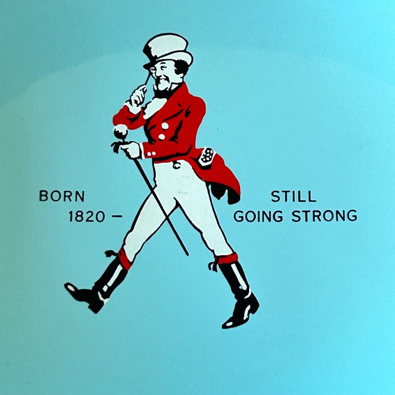 May include: Illustration of a man in a red coat and white pants, walking with a cane. The text reads "BORN 1820 - STILL GOING STRONG" on a light blue background. The man is wearing a top hat and black boots.