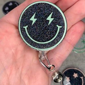 Smiley Face Badge Reel Fun and Colorful - Interchangeable Eye Designs (X&#39;s, Hearts, Lightning Bolts, Stars) - Bright, Customizable ID Holder