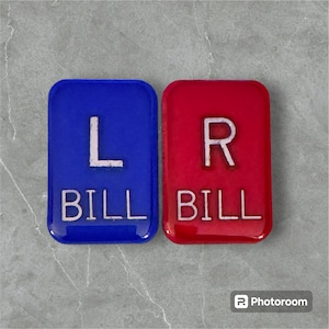 May include: Two blue and red square tiles with white lettering. The blue tile says "L BILL" and the red tile says "R BILL".