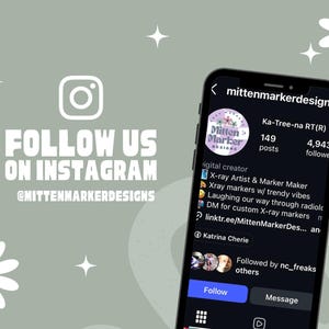 May include: A smartphone displays an Instagram profile with the username "mittenmarkerdesigns." The profile features a logo and the text "Follow Us On Instagram @mittenmarkerdesigns." The background is a light green with daisy and star graphics.