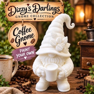 May include: A white gnome figurine holding a mug, featuring a tall hat decorated with coffee bean and leaf motifs. Above the gnome, a wooden sign reads Dizzy's Darlings GNOME COLLECTION, with a circular sign below stating Coffee Gnome PAINT YOUR OWN.