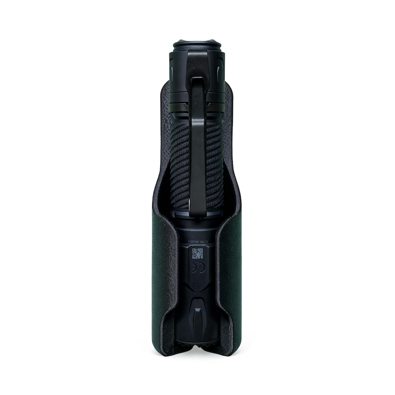 May include: A black flashlight with a textured grip is held in a dark green leather case. The flashlight has a metal clip and a button at the base. The case has a soft, felt-like interior.