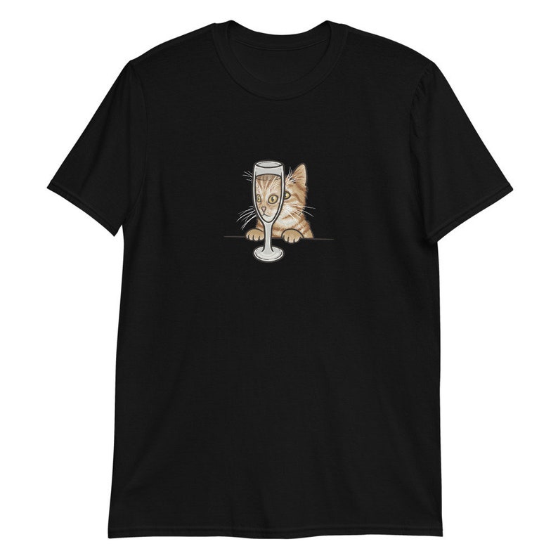 May include: A black t-shirt with a graphic of a cat peeking out of a champagne glass.