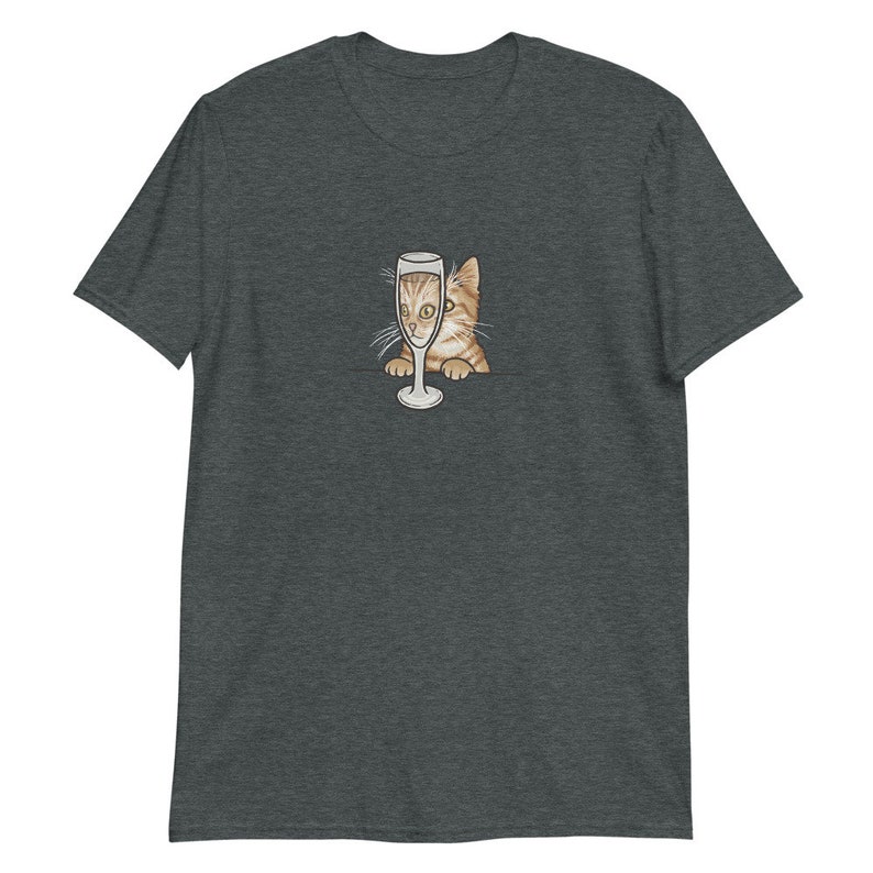 May include: A dark heather grey t-shirt with a graphic of a cat peeking out of a champagne glass.