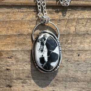 Sterling silver and white buffalo pendant necklace. 18 inch chain.