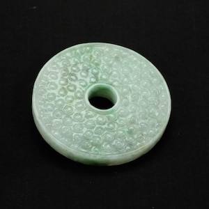 Magnificent 52mm Natural Jadeite Jade Donut Pendant - Intricate Grain Carving, Symbol of Heaven & Protection. Exquisite Asian Artistry.