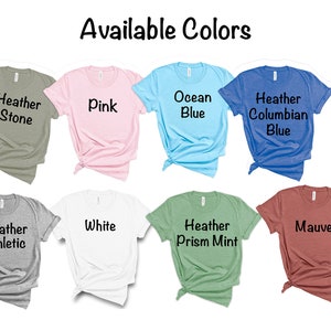 May include: Eight t-shirts in different colors, including Heather Stone, Pink, Ocean Blue, Heather Columbian Blue, Heather Athletic, White, Heather Prism Mint, and Mauve. The t-shirts are laid out on a white background. Available Colors is written at the top of the image.