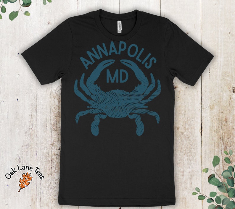 May include: Black t-shirt with a blue crab graphic and the text "ANNAPOLIS MD".