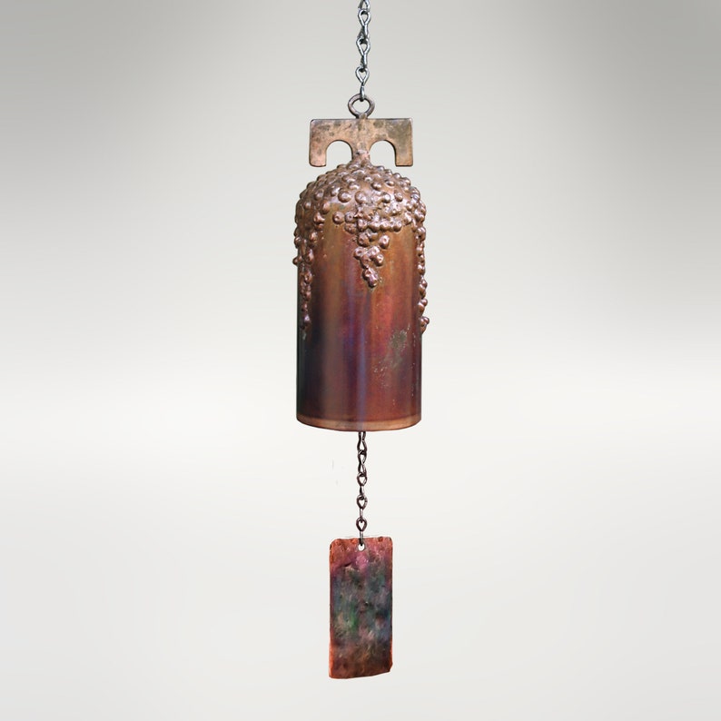 San Gabriel Mission Wind Bell by Marc Staples: A hand-forged steel sound sculpture with a grape cluster motif and hand-applied torched-copper patina.