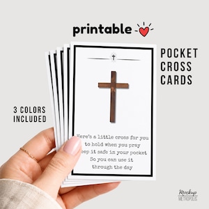 May include: A stack of rectangular white pocket cross cards with a black border. Each card features a small brown wooden cross graphic and the text: Here's a little cross for you to hold when you pray, keep it safe in your pocket, so you can use it through the day.
