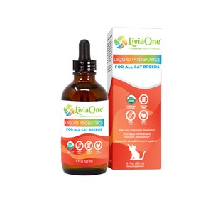 May include: A 4-ounce bottle of Livia One Liquid Probiotics for all cat breeds. The bottle is brown glass with a dropper top. The label is red, white, and green with the text "Livia One" and "Liquid Probiotics for All Cat Breeds". The bottle is next to a box with the same design and text. The box also includes a list of certifications, including USDA Certified Organic, Gluten Free, Non-GMO, and Vegan.
